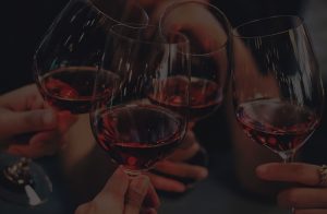 A tinted photo with four glasses of red wine