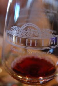 A bottle of wine with the logo for Wilhelm Family Vineyards