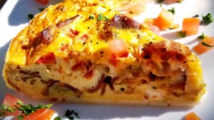 A Close Up of a Slice of Quiche Served at Brunch