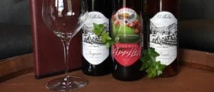 Three bottles of our wines: a Sangria, a Sangiovese, and a Rosado wine